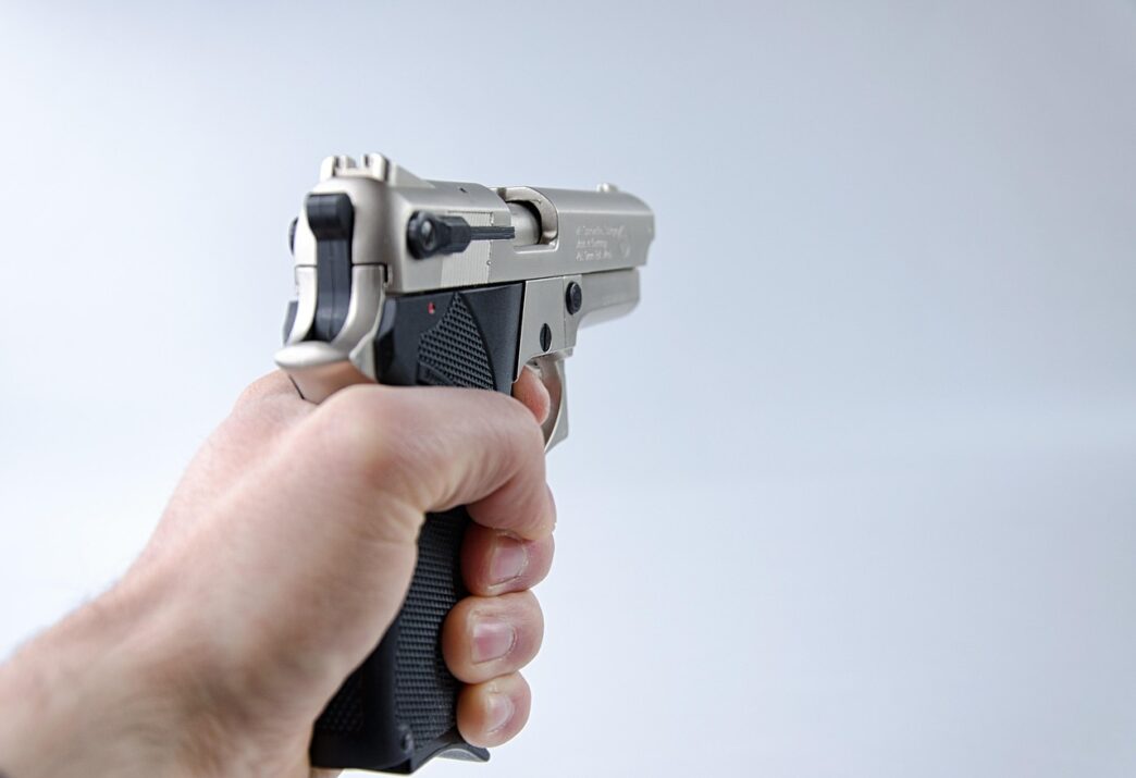 pistol in hand
